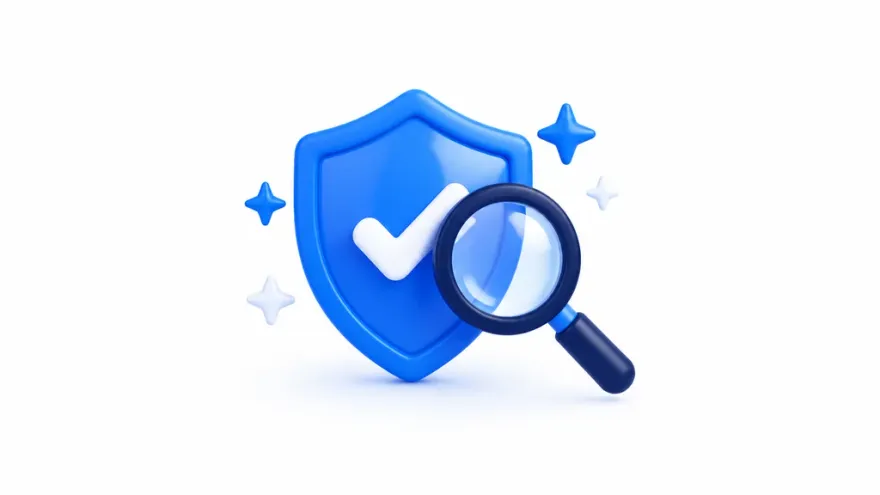 Magnifying glass inspecting a shield icon with a checkmark
