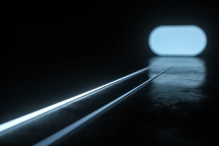 Two light trails of different length on a dark surface, one short and bright, one long and dim