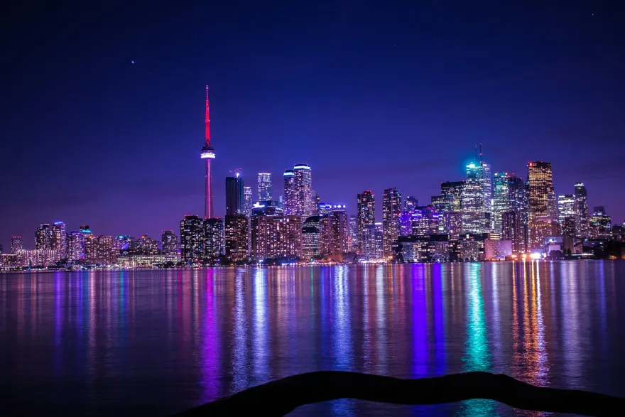 Toronto skyline at night with the CN Tower illuminated